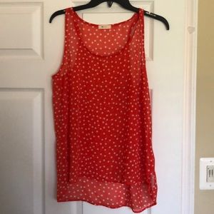 Red sheet tanks with white polka Dots